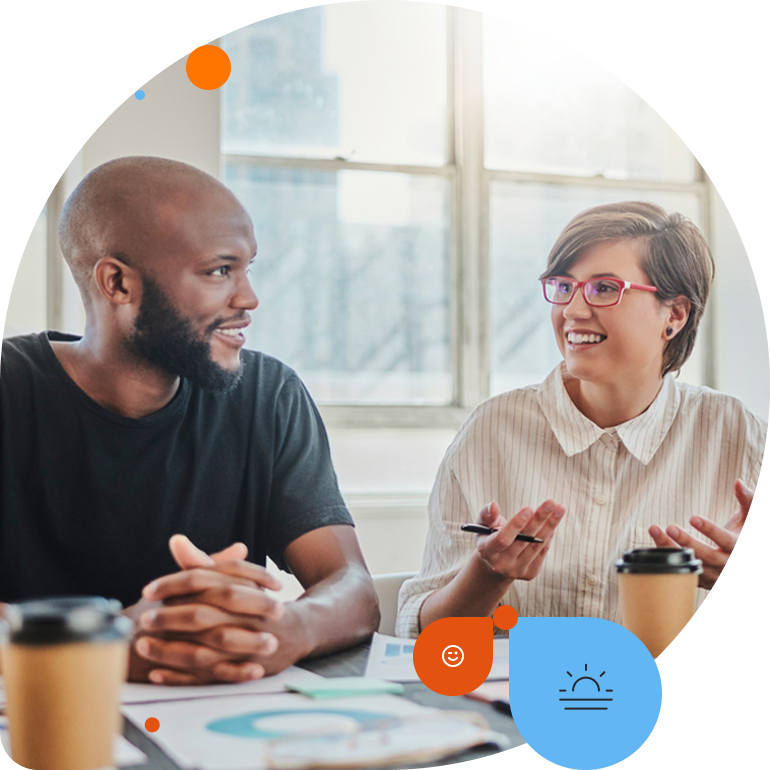 image of a male and female employee talking at work